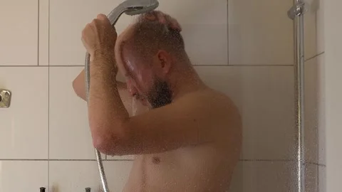 Man washing in the shower. Stock Footage 243372266