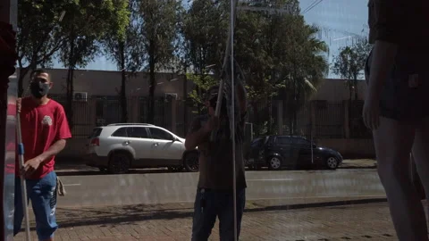 Man washing store windows Stock Footage 163459271