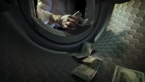 Man Washing US Dollar Banknotes in Washing Machine slow motion. Money Laundering Stock Footage 340170969