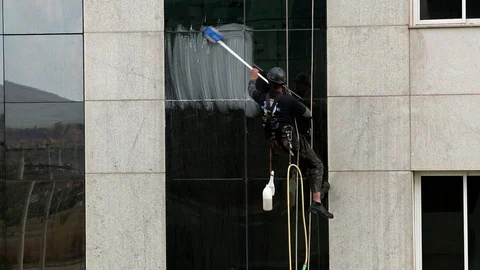 Man Washing Windows Stock Footage 117129691