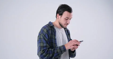 Man watch disgusting videos using mobile phone 動画素材 143940953