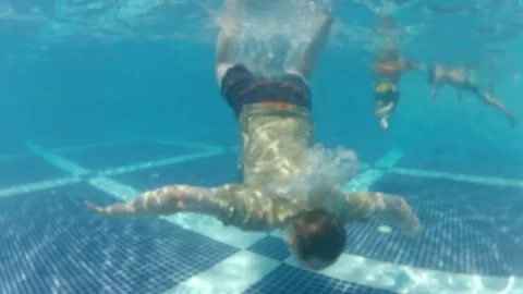 Man watch smartphone but accidentally drop it under water at pool bottom Video stock 81359108