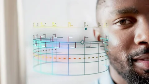Man watching 3D cylinder triggered by timeline fading, analyzing tech data with Stock Footage 333169874
