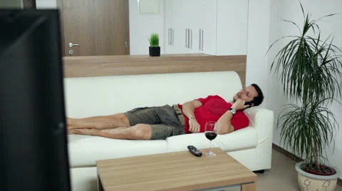 Man watching boring TV programme Video stock 47250700