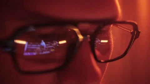 Man watching box streaming, close up face of sport fan. Reflection in glasses 動画素材 233005432