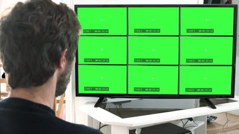 Man Watching CCTV Security Cameras Chroma Key Monitor Video stock 142079051