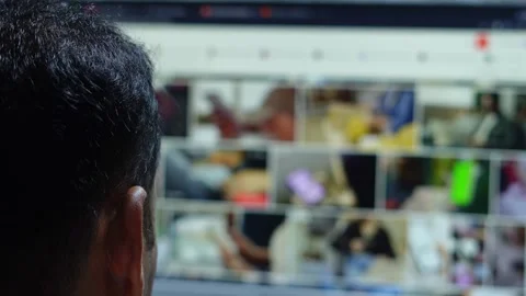 Man watching computer screen scrolling through videos Stock Footage 345740986