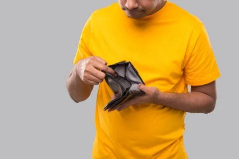 Man Watching Empty Wallet Close Up. No Money Concept. No Salary Isolated Stock Photos