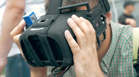 Man watching flight of FPV drone using VR glasses Stock Footage 67957219