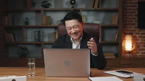 Man watching funny videos on laptop and Stock Video Pond5