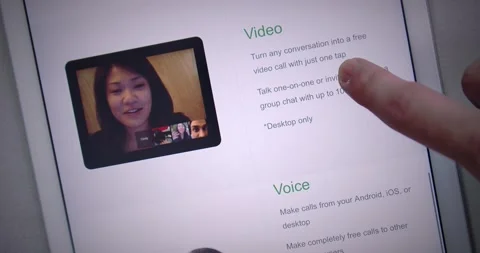 Man watching Google Hangouts website on iPad by scroll and swipe Stock Footage 149877822