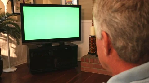 Man Watching Greenscreen TV 2 4K Stock Footage 40449246