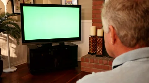 Man Watching Greenscreen TV 4K Stock Footage 40449245
