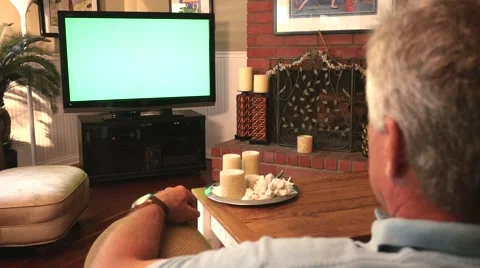 Man Watching Greenscreen TV Dolly Move 4K Stock Footage 40449166