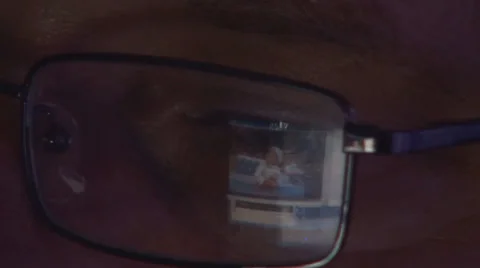 Man Watching his Child on Computer, Laptop, Surfing Internet in Night, Office Video stock 33549271