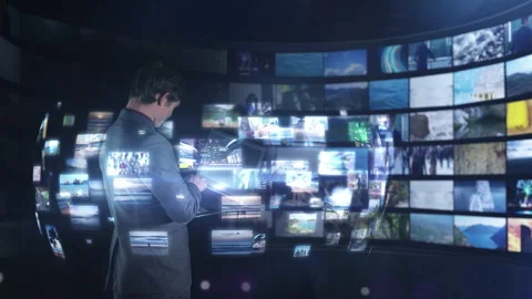 Man watching immersive multimedia content on video wall Video stock 321388099