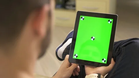 A man watching on an iPad Stock Footage 87385078