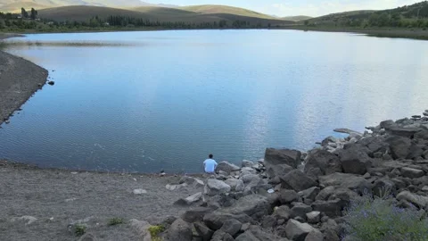 Man watching lake nature Stock Footage 240740685