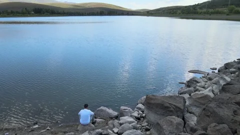 Man watching lake nature Stock Footage 240740774
