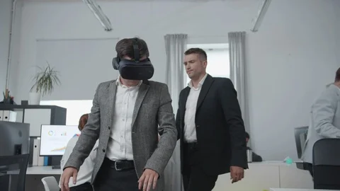 Man is watching on the office through virtual reality glasses. Stock Footage 116621398
