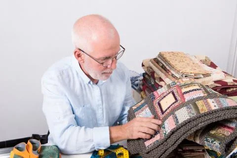 Man watching the patchwork in the workshop 스톡 사진