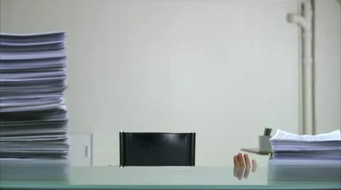Man watching piles of paper increasing and decreasing 库存影片 11303032