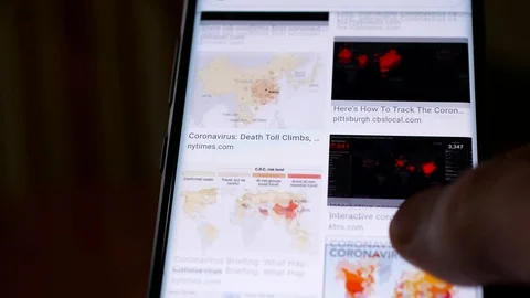 Man watching the quick spread of the new Coronavirus Stock-Footage 127115646