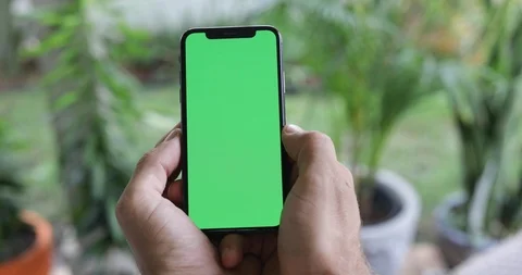Man Watching A Smart Phone With Chroma Key Green Screen Stock Footage 120670432
