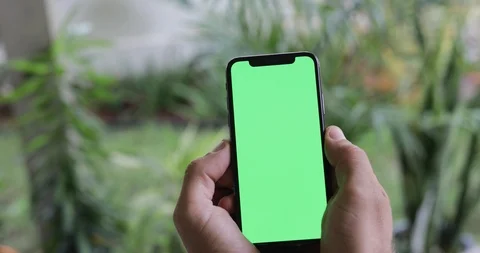 Man Watching A Smart Phone With Chroma Key Green Screen Stock Footage 120670437