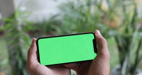 Man Watching A Smart Phone With Chroma Key Green Screen Stock Footage 120670448