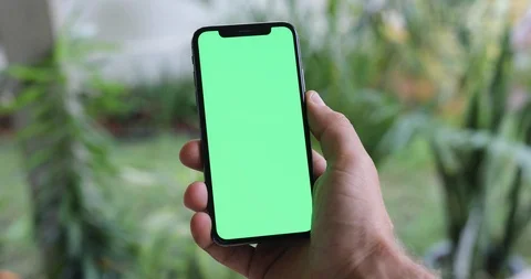 Man Watching A Smart Phone With Chroma Key Green Screen Stock Footage 120670451