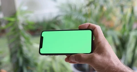 Man Watching A Smart Phone With Chroma Key Green Screen Stock Footage 120670456