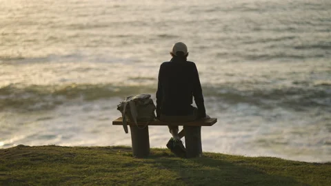 Man watching the sunset around big cliffs in Basque Coast, Spain Video stock 154776859