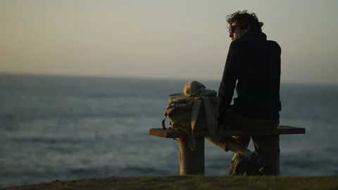 Man watching the sunset around big cliffs in Basque Coast, Spain Video stock 154776982