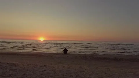 Man watching sunset at beach. Stock Footage 203880416