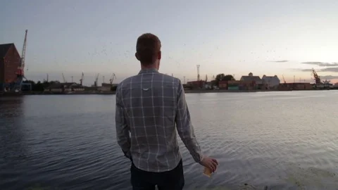 Man watching sunset drink coffee on sea port hd Stock Footage 70772369