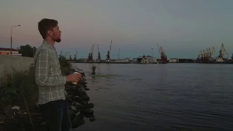 Man watching sunset drink coffee on sea port hd Stock Footage 70772408