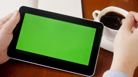 Man watching tablet with green screen in cafe Video stock 31866847