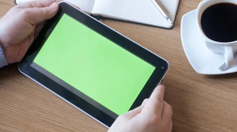 Man watching tablet with green screen in cafe 스톡 동영상 31922027