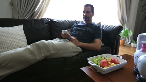 Man watching television 2 Stock Footage 25421288