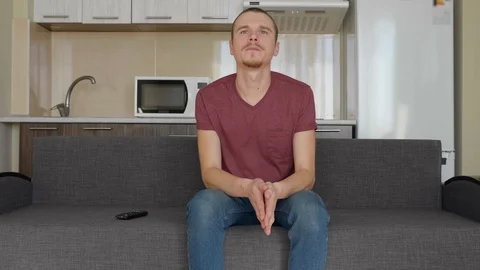 A man is watching TV Stock Footage 107653188