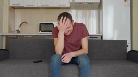 A man is watching TV Stock Footage 107653462