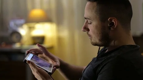 Man watching video or listening music on. Stock Video Pond5