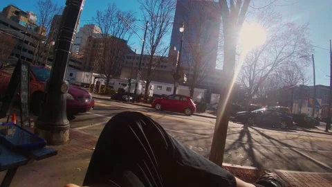 Man watchs downtown scenery while relaxing Stock Footage 147568882
