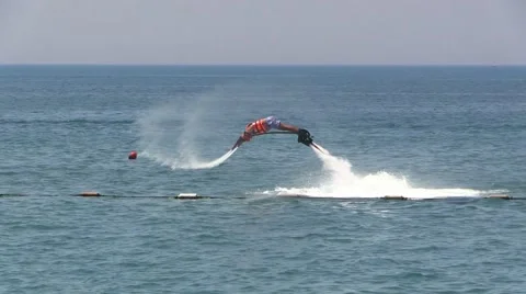Man on Water Jet Pack Flyboard near Sea Beach Resort Stock Footage 40322722