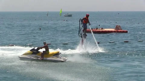 Man on Water Jet Pack Flyboard near Sea Beach Resort Stock Footage 40323119
