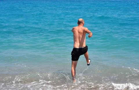 Man into the water Stock Photos