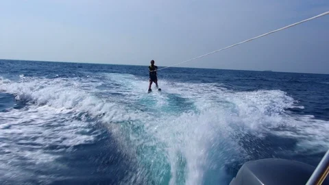 Man Water Skiing Being Dragged By A Powerboat Stock Footage 125863533