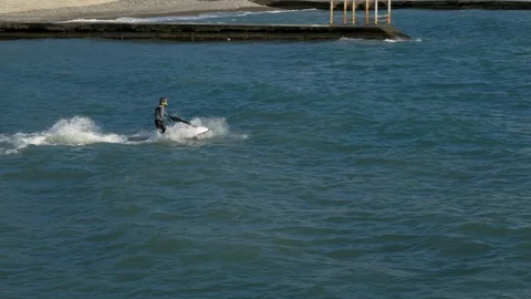 Man on watercraft with jump on the waves Stock Footage 105207489