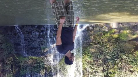 Man in the waterfall Stock Photos